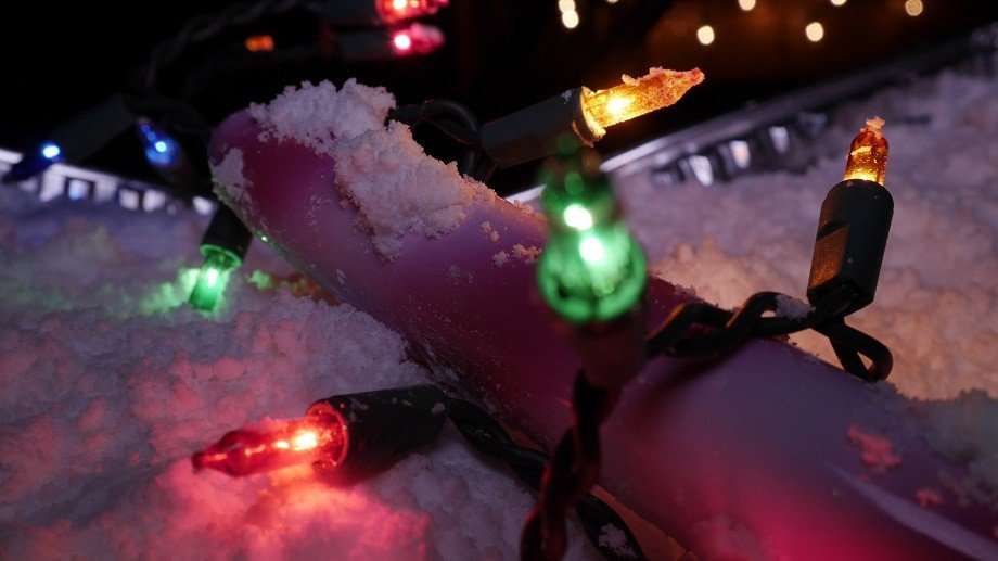 Calextics Candy Cane Vibrator among holiday lights in snow